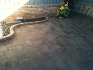 backyard patio with mutli colored brick tiles